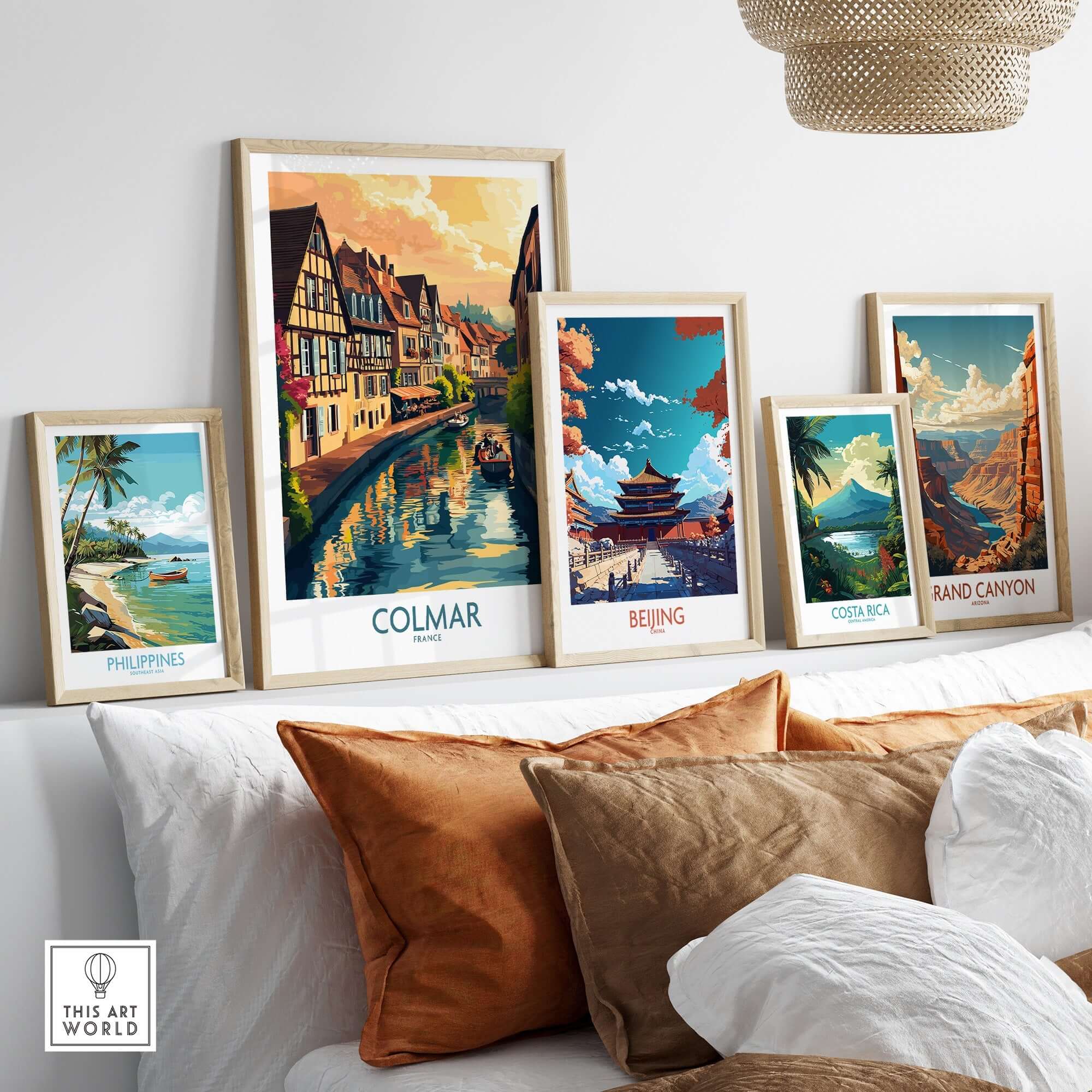 Framed travel posters including Colmar Print, showcasing scenic views of Colmar and other destinations.