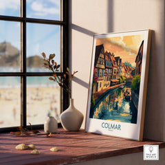 Colmar Print displayed in a cozy interior with a scenic view of Colmar, France, capturing the town's charm and beauty.