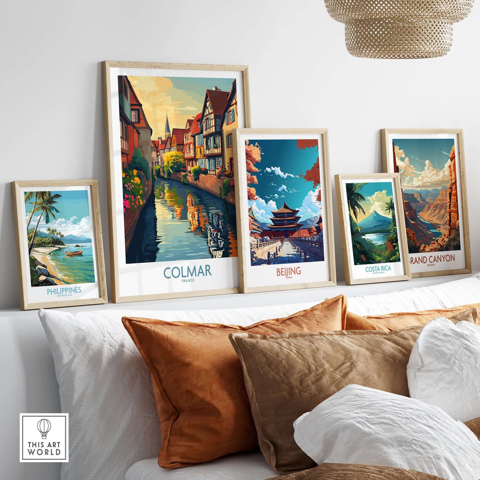 Colmar Travel Poster displayed among other travel posters in a stylish home setting with vibrant colors.