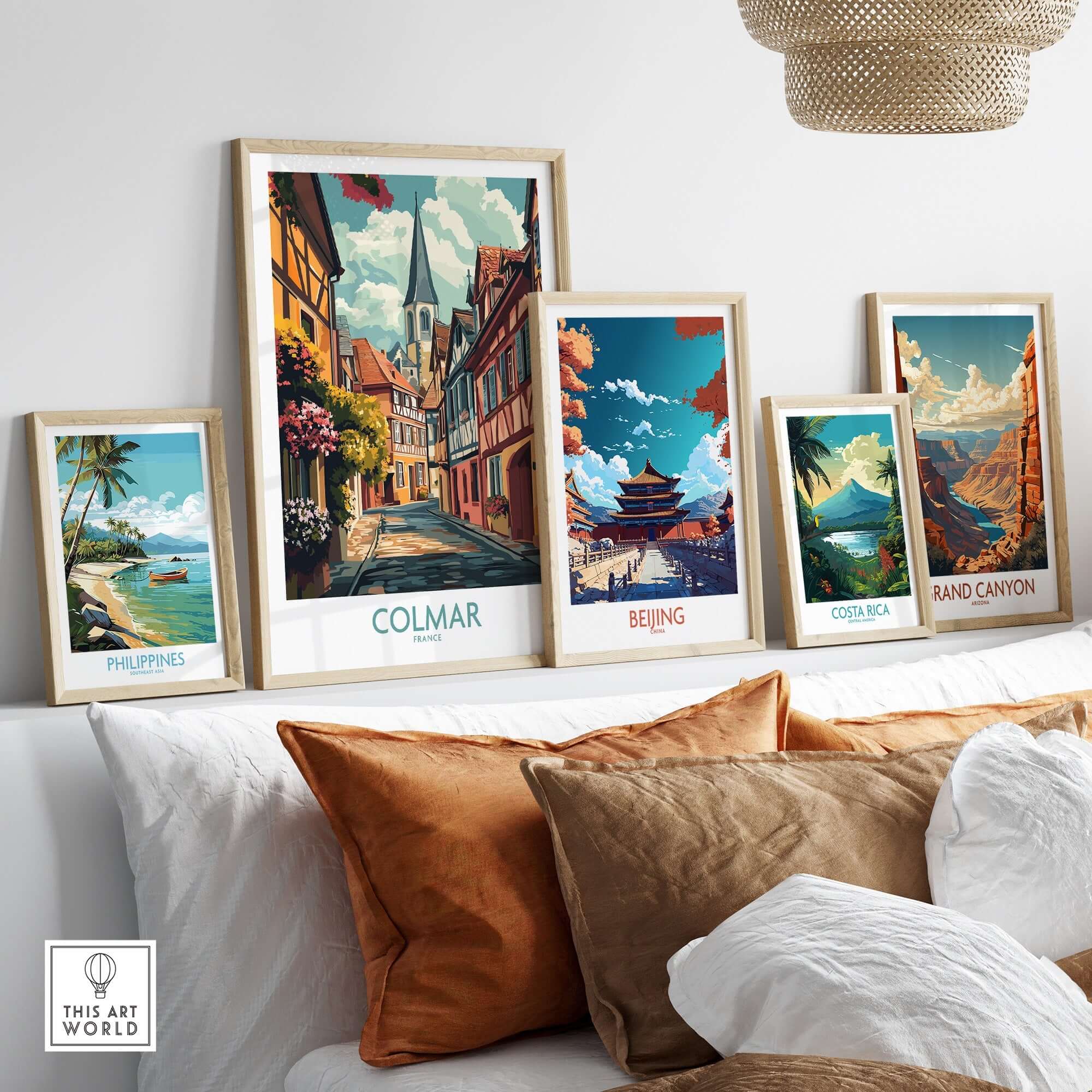 Colmar Wall Art Print displayed among other travel posters and framed artwork on a stylish shelf.