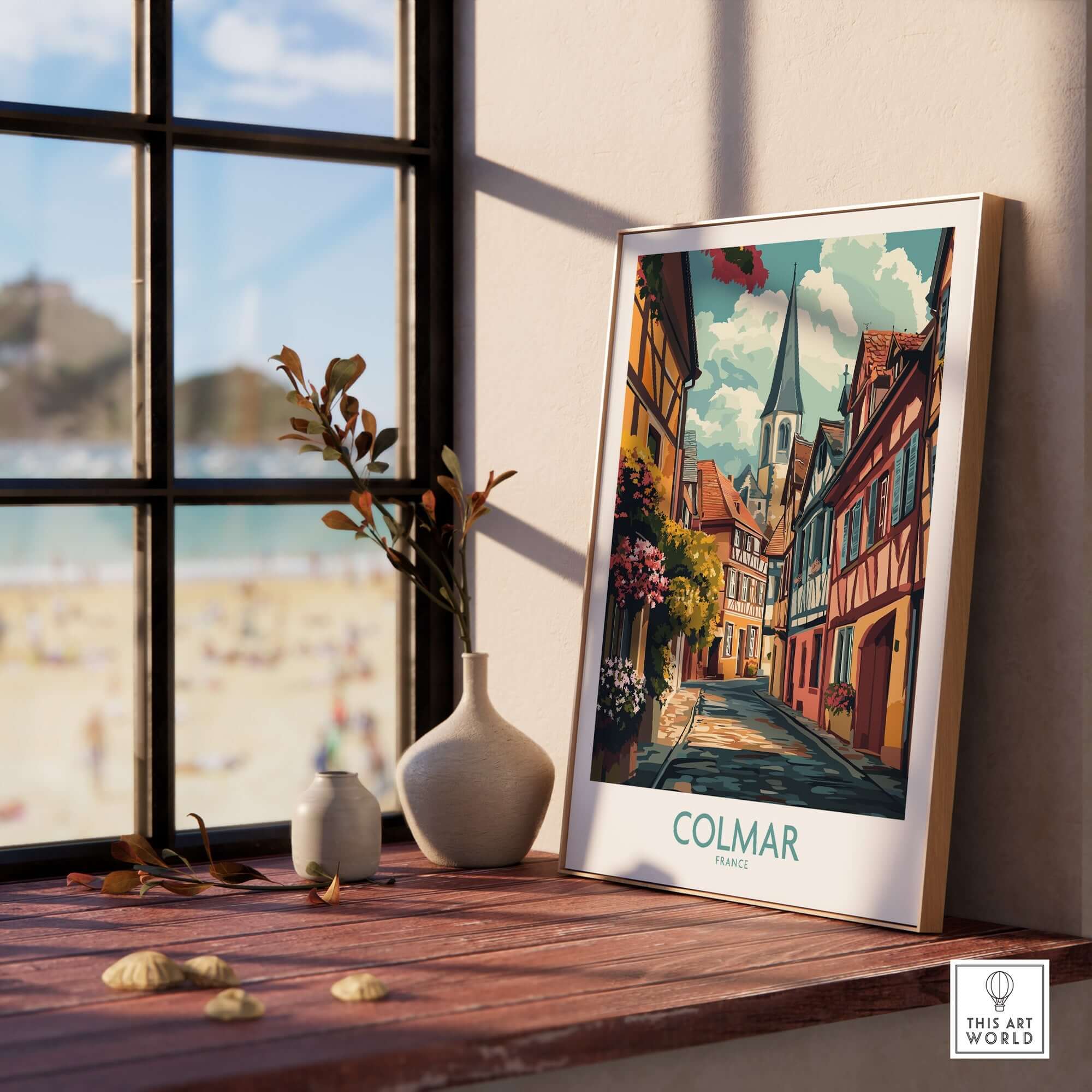 Colmar Wall Art Print displayed on a wooden table by a window, showcasing vibrant colors and charming details.
