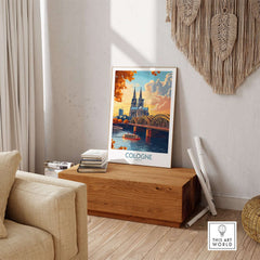 Cologne Art Print showcasing a vibrant depiction of the city with architecture and a river scene in a stylish interior.