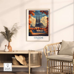 Cologne Travel Poster featuring the Cologne Cathedral surrounded by autumn leaves in a stylish interior setting.