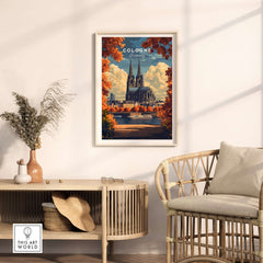Cologne Travel Print featuring the iconic Cologne Cathedral, vibrant colors, and autumn leaves in a stylish interior.