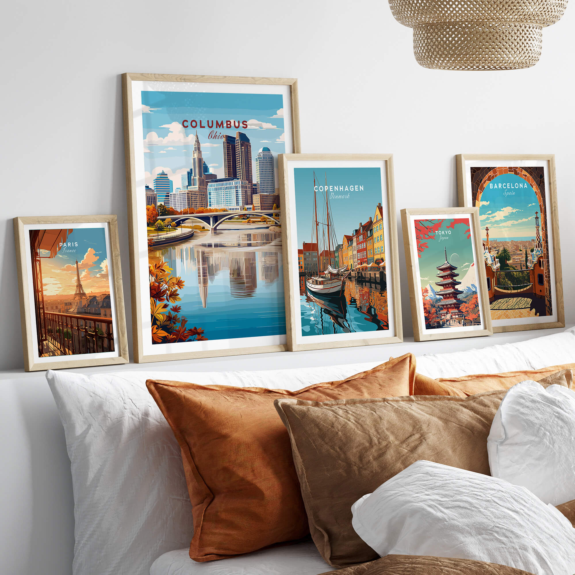 Columbus Ohio Travel Poster – City Skyline featured among various travel posters on a stylish bed display.