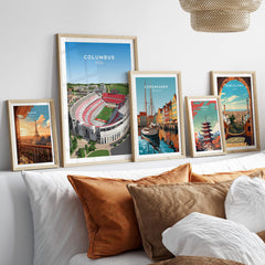 Columbus Ohio Travel Poster – Ohio State Stadium Art Print framed on a wall with other travel posters and decorative pillows.