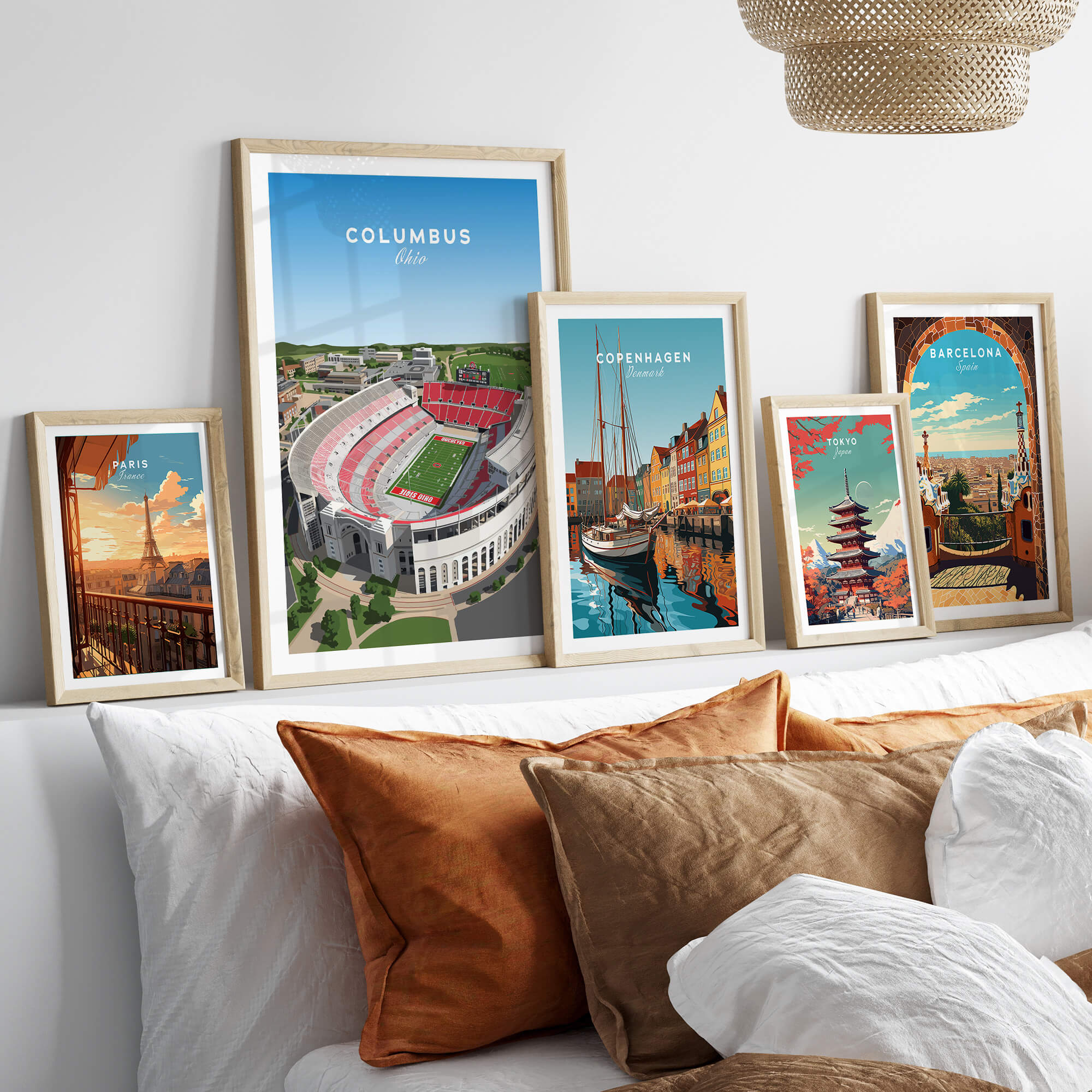 Columbus Ohio Travel Poster – Ohio State Stadium Art Print framed on a wall with other travel posters and decorative pillows.