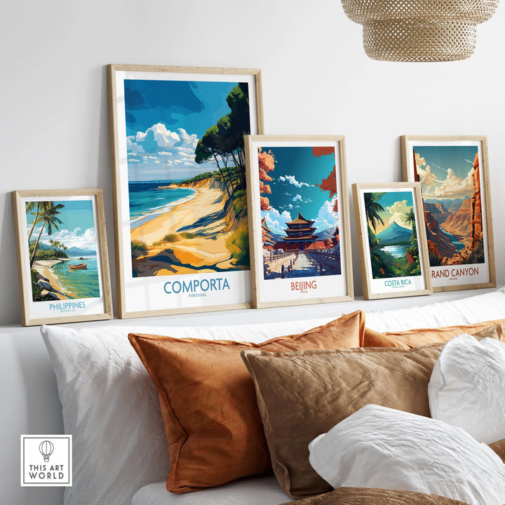 Framed prints of Comporta, Beijing, Costa Rica, and the Grand Canyon displayed on a cozy sofa, showcasing travel destinations.
