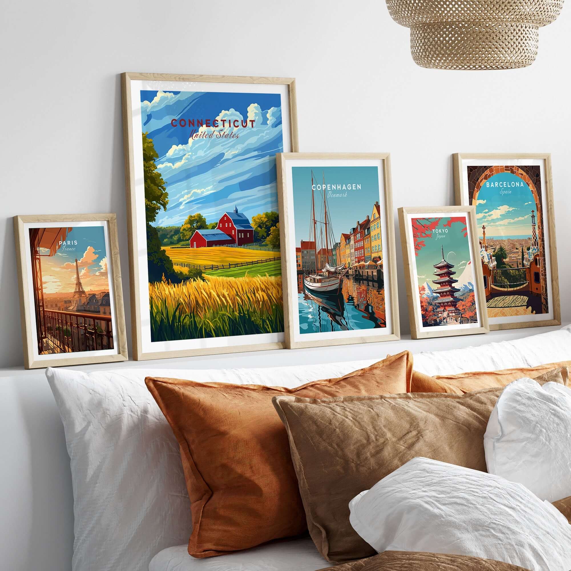 Connecticut Art Print displayed among travel posters in a modern living room setting with decorative pillows.