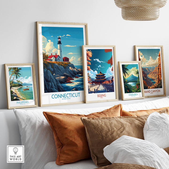 "Connecticut travel poster framed on wall alongside global destinations, featuring vibrant artwork of New England's picturesque charm."