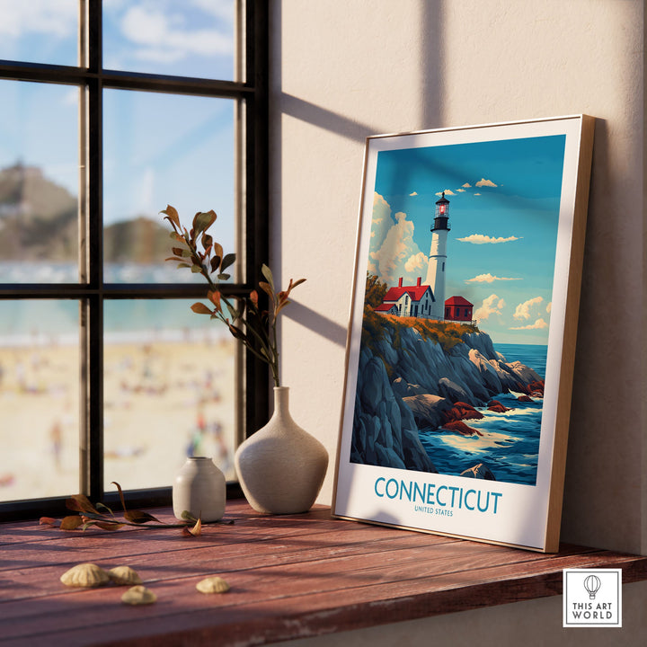 Connecticut New England lighthouse print displayed on a windowsill with a beach view, showcasing vibrant scenic art.