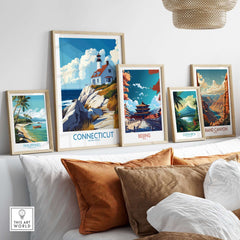 Connecticut Travel Poster among other travel posters on a shelf, showcasing scenic beauty and nostalgia.