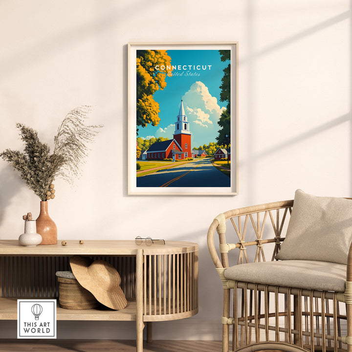 Connecticut wall art in living room with wicker chair and console, showcasing a classic New England church scene.