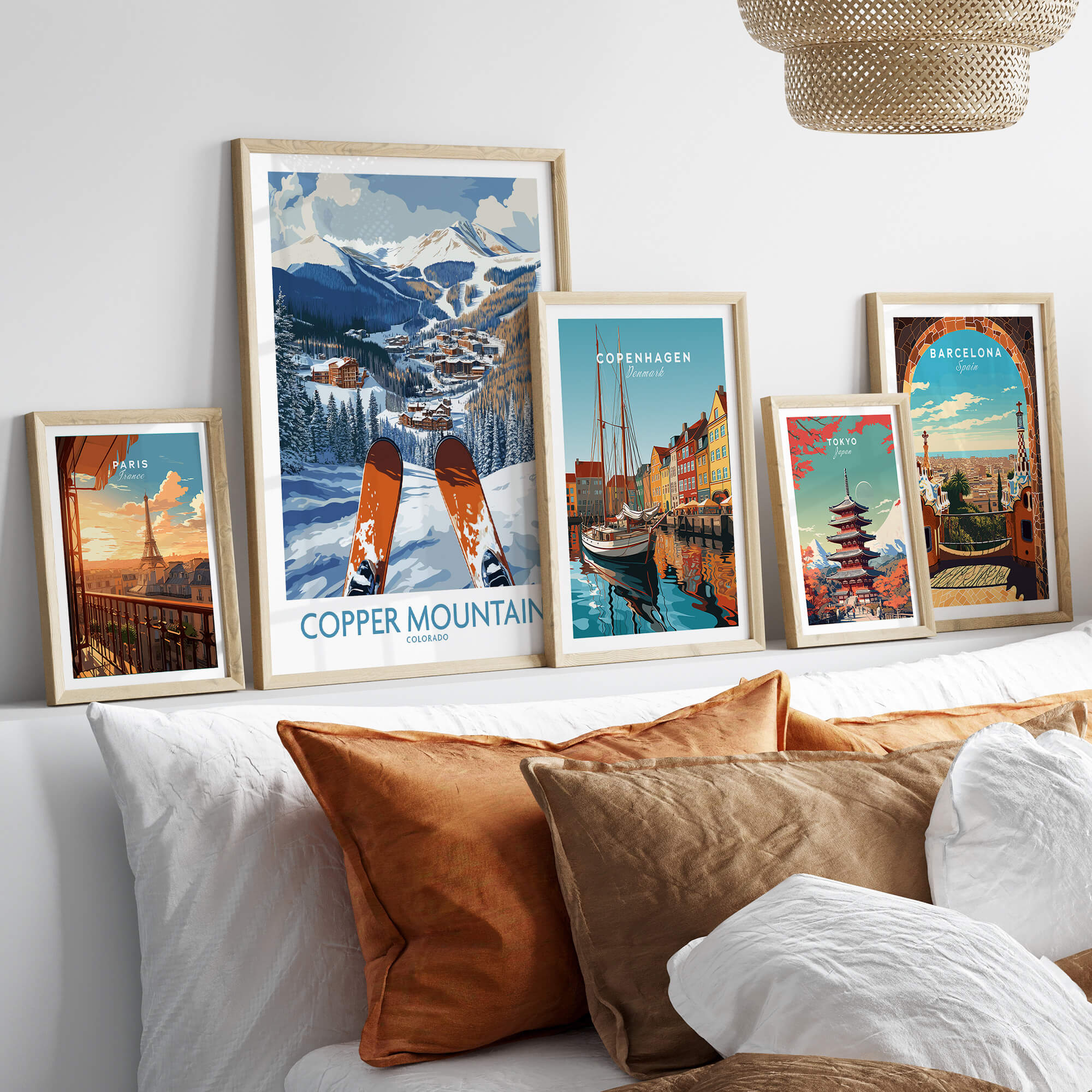 Copper Mountain Colorado Ski Print – Alpine Resort displayed among other travel art prints on a stylish bed.