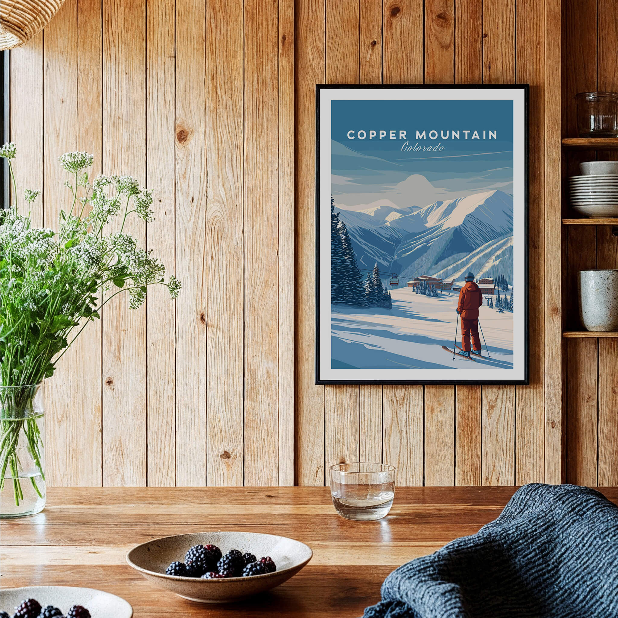 Copper Mountain Ski Poster framed on a rustic wooden wall with a skier in the snowy landscape.