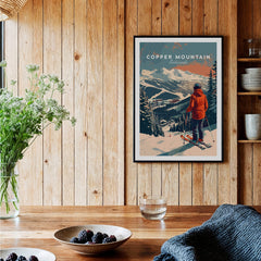 Copper Mountain Travel Poster – Skiing Into Sunset displayed in a cozy interior with wooden walls.
