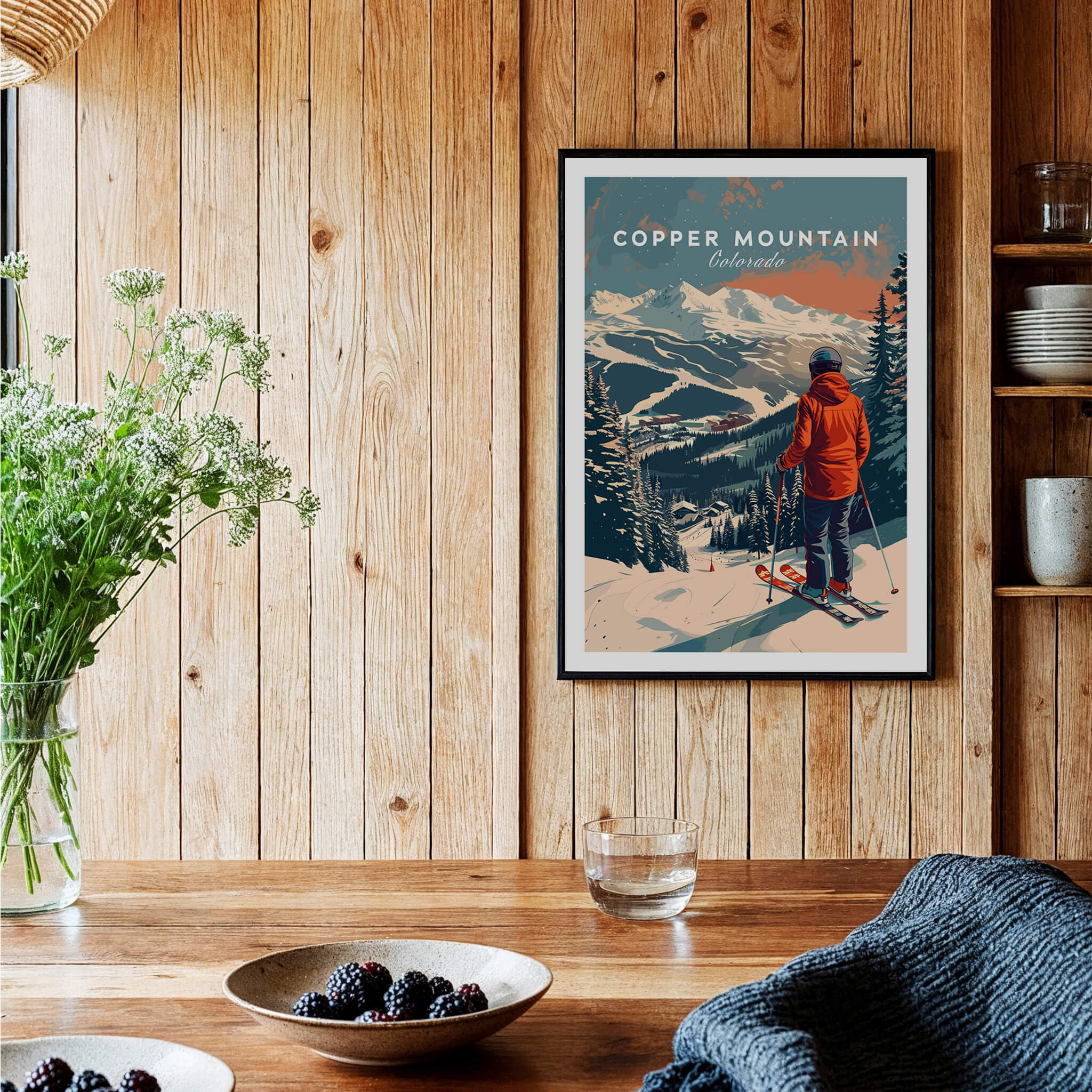 Copper Mountain Travel Poster – Skiing Into Sunset displayed in a cozy interior with wooden walls.