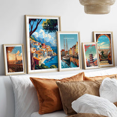Corsica Wall Art displayed among other travel-themed artworks in a stylish living room setting.