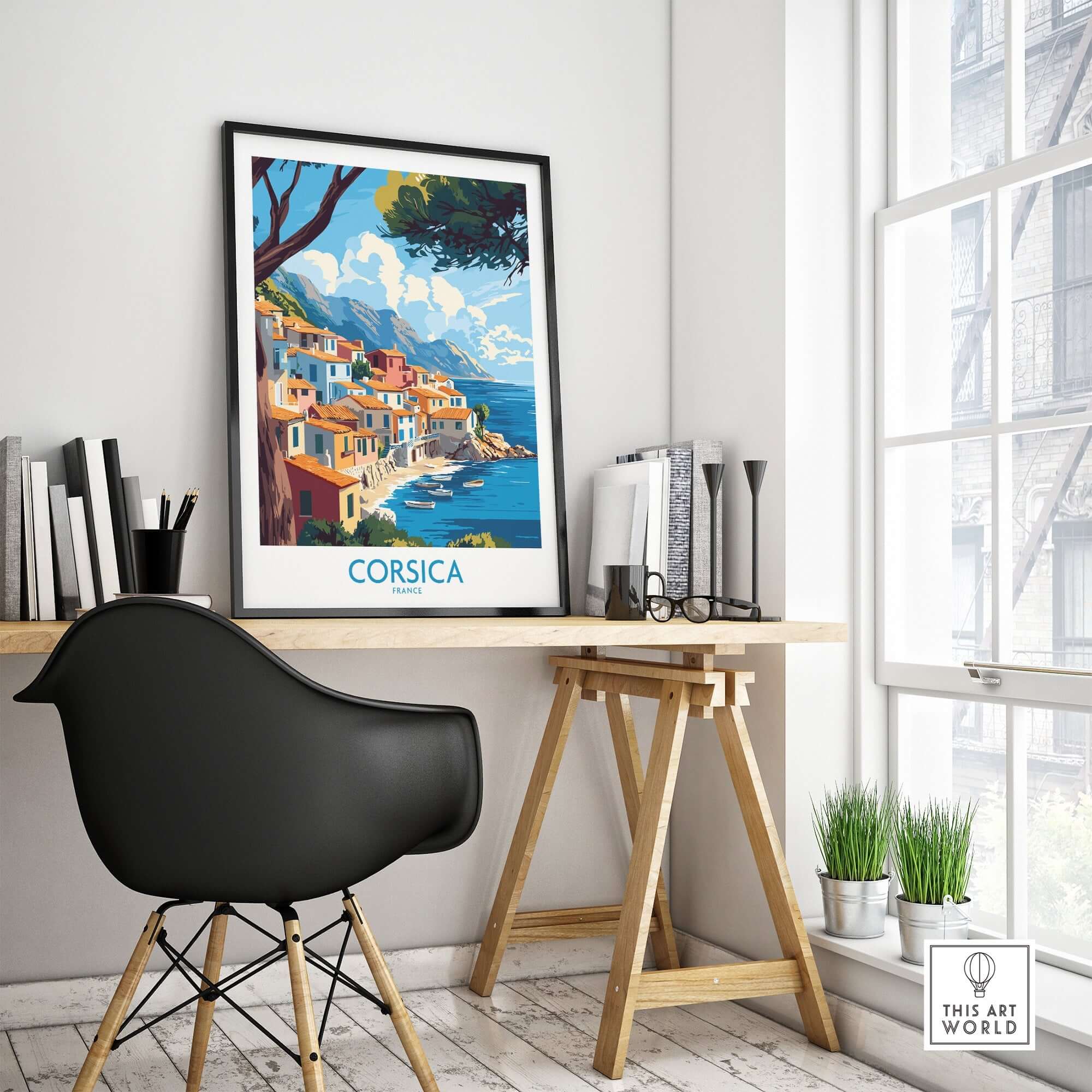Corsica Wall Art Print displayed in an elegant interior with a black chair and wooden easel, showcasing vibrant coastal colors.