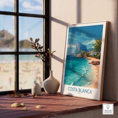 Costa Blanca Poster - Spain Wall Art displayed on a wooden table, showcasing a beautiful coastal landscape.