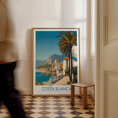 Costa Blanca Wall Art - Canvas Poster Spain displayed in a stylish interior with a palm tree and scenic coastline.