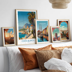 Costa Blanca Wall Art - Canvas Poster Spain displayed among other framed art prints on a stylish living room shelf.