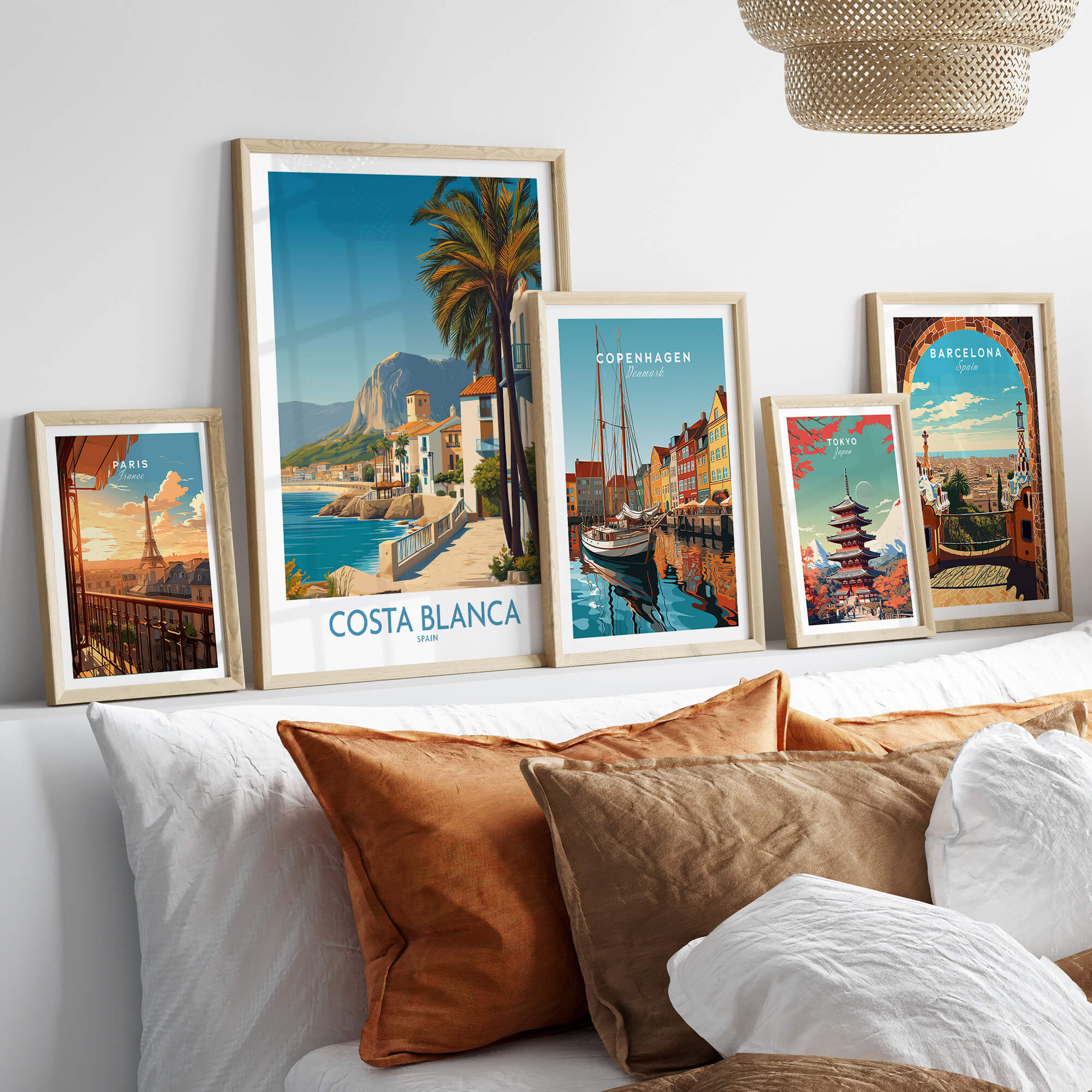 Costa Blanca Wall Art - Canvas Poster Spain displayed among other framed art prints on a stylish living room shelf.