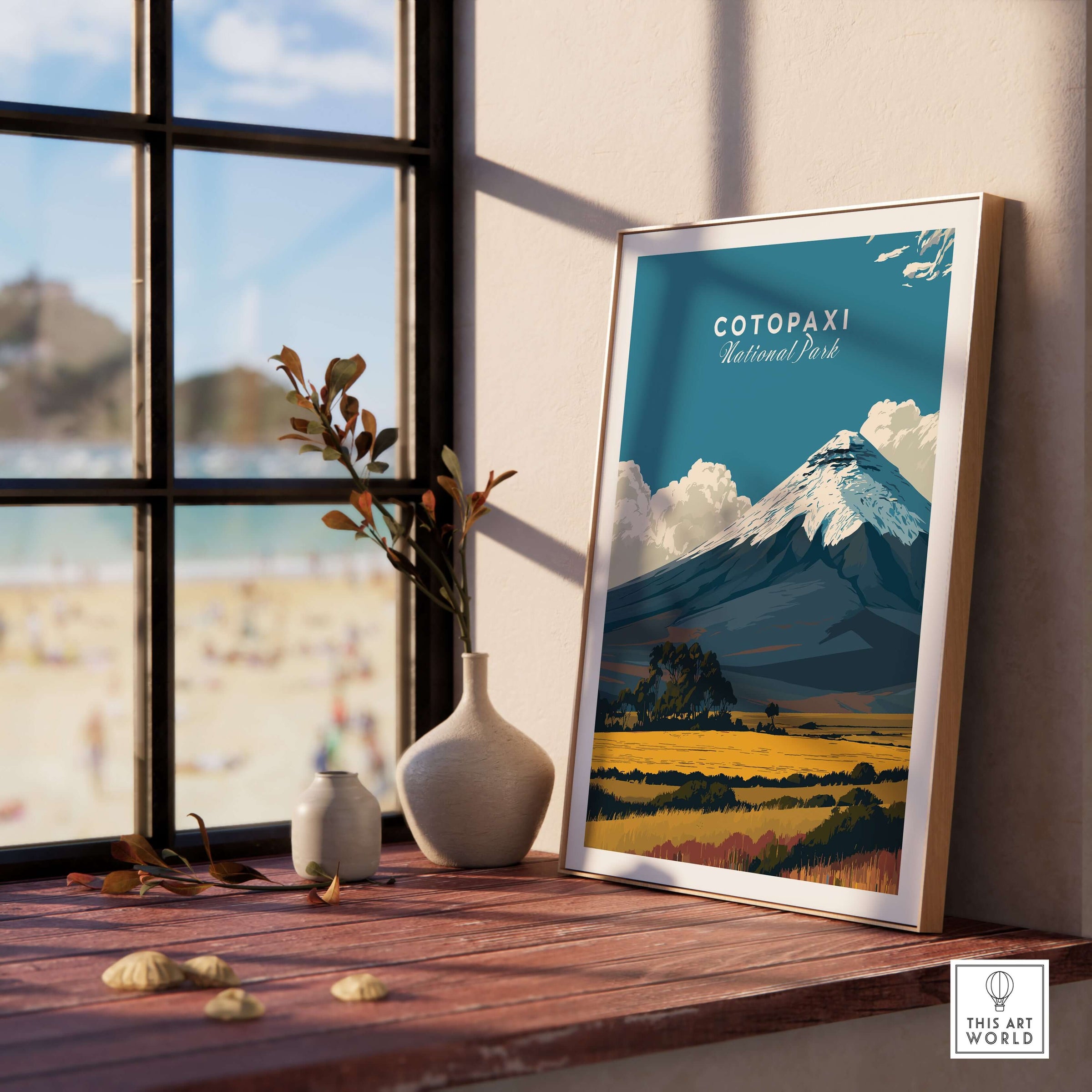 Cotopaxi National Park Travel Poster Ecuador Volcano Golden Field Print Wall Art displayed in a cozy interior near a window.