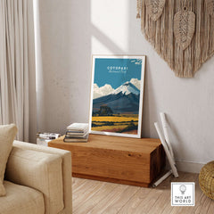 Cotopaxi National Park Travel Poster Ecuador Volcano Golden Field Print Wall Art displayed in a stylish living room.