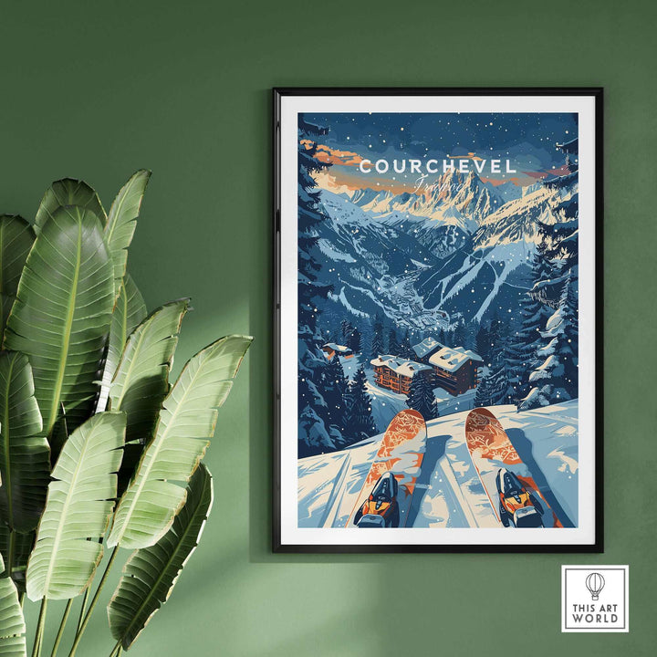 Framed Courchevel print featuring snowy French Alps skiing scene, displayed against a green wall with tropical leaves.