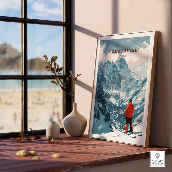 Vintage Courchevel ski poster on a windowsill, featuring a skier in the mountains, with natural light and decorative vases nearby.