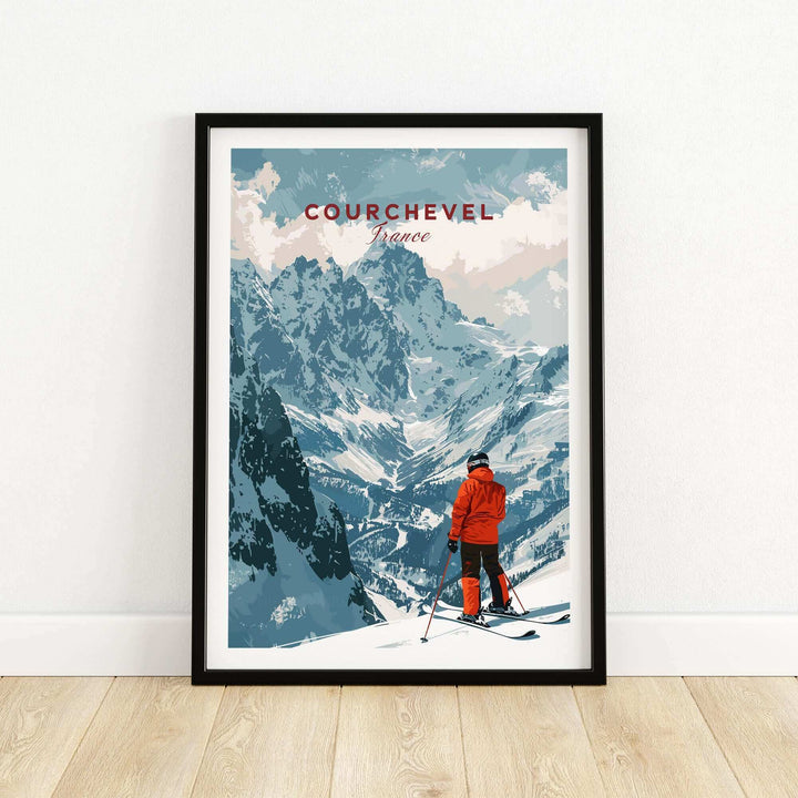 Vintage-style Courchevel ski poster featuring a skier in red overlooking snowy mountains in France, framed and displayed on a wall.