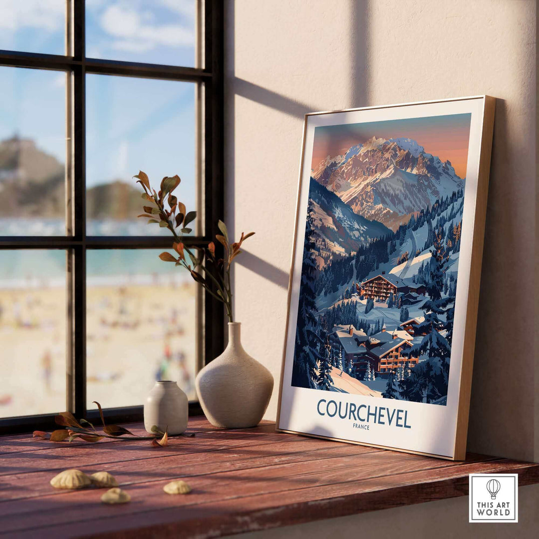 Courchevel ski print framed on a wooden table near a window, showcasing the beauty of the French Alps.