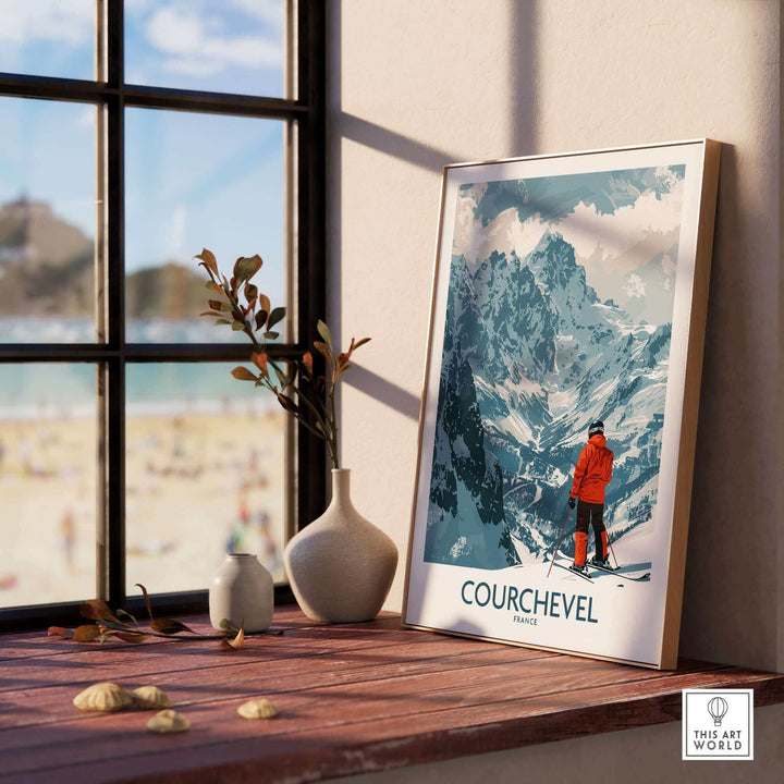 Courchevel Wall Art featuring a skier in red against snowy mountains, displayed on a window ledge with decorative vases.