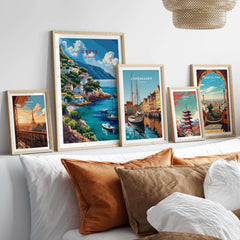 Crete Greece Poster Print displayed among various travel posters on a stylish wall above a cozy sofa.