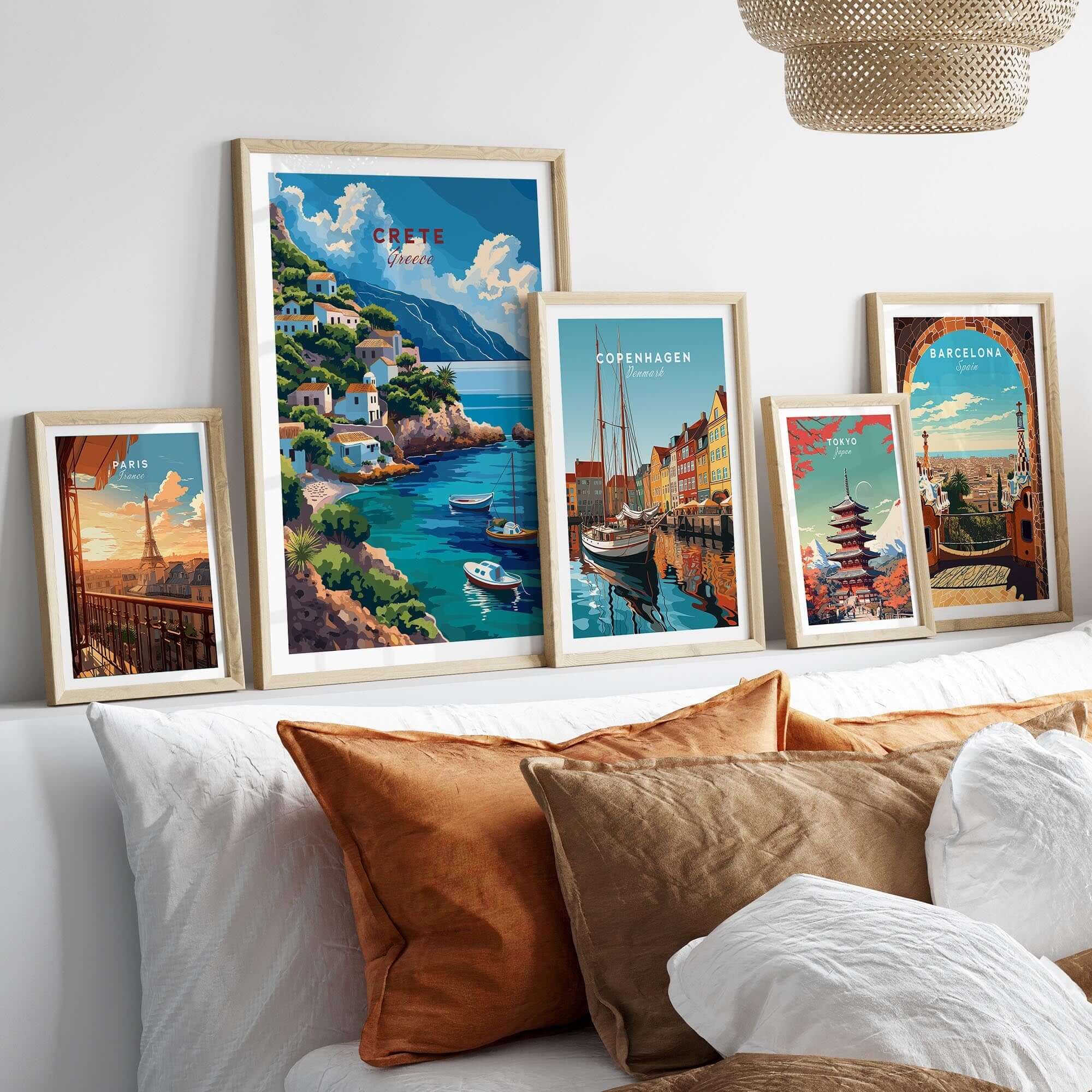 Crete Greece Poster Print displayed among various travel posters on a stylish wall above a cozy sofa.