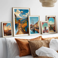Cusco City Print | Inca Valley Wall Decor displayed among framed city prints on a cozy bed setting.