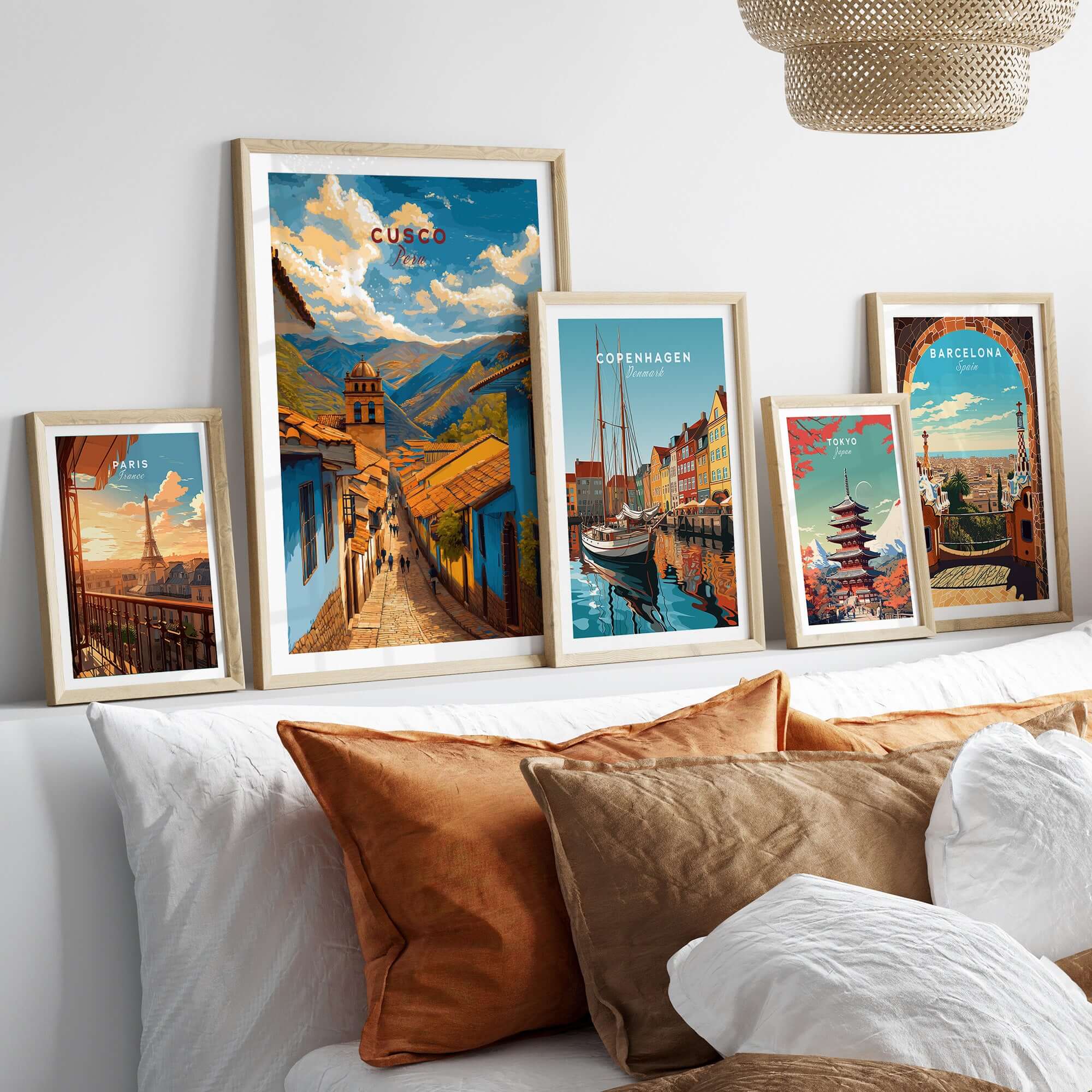Cusco City Print | Inca Valley Wall Decor displayed among framed city prints on a cozy bed setting.