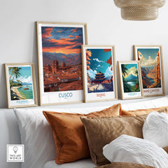Cusco Peru Orange Sunset Art Print | Mountain City Skyline Poster displayed among other art prints on a cozy couch.