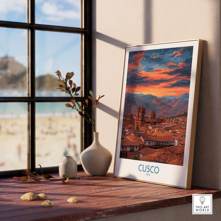 Cusco Peru Orange Sunset Art Print | Mountain City Skyline Poster framed on a windowsill with a view of the beach.