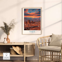 Cusco Peru Orange Sunset Art Print | Mountain City Skyline Poster on wall above rattan chair in aesthetic living room.