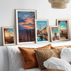 Cusco Peru Print | Peruvian Travel Wall Decor displayed among other city prints on a stylish couch.