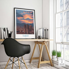 Cusco Peru Sunset Cathedral Art Print | Vibrant Andes City Poster framed on a desk with a modern chair and plants.