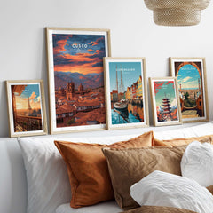 Cusco Print | Peru Travel Wall Decor displayed among various travel artworks on a cozy sofa.