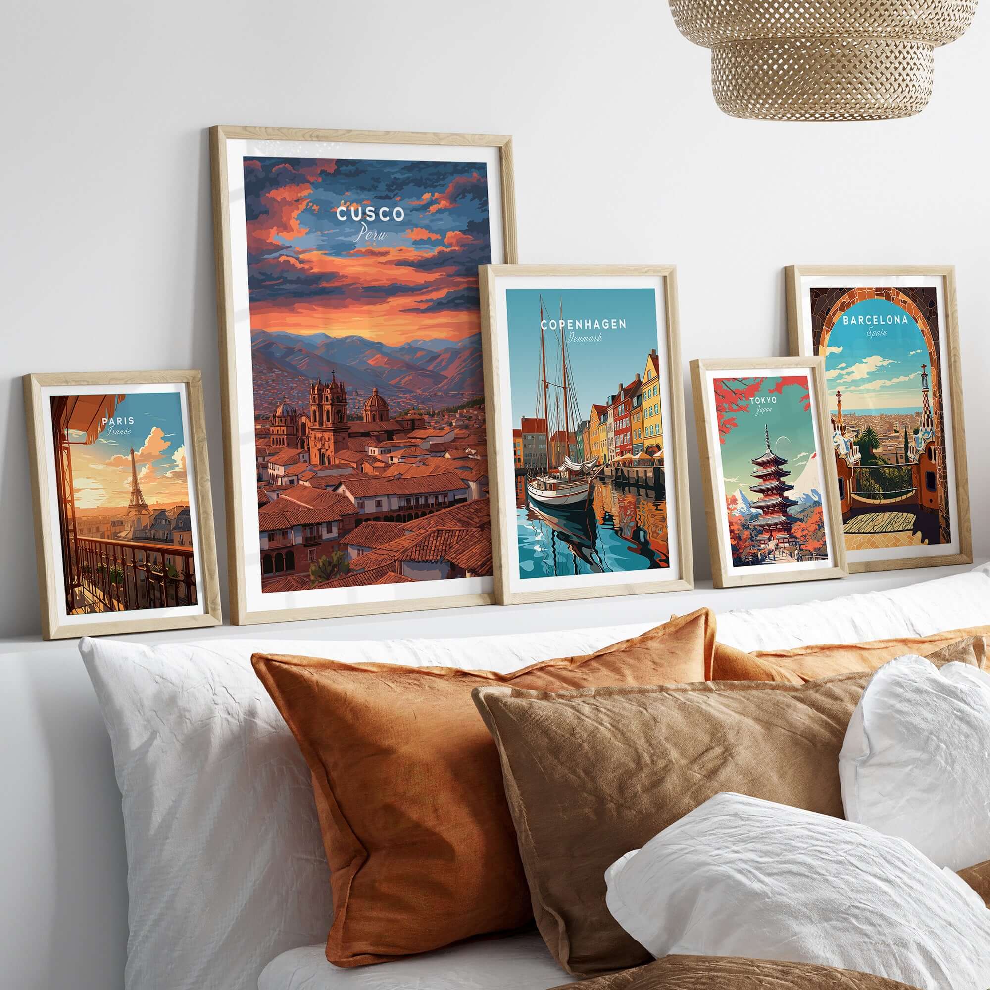 Cusco Print | Peru Travel Wall Decor displayed among various travel artworks on a cozy sofa.