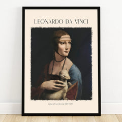 Framed Leonardo da Vinci Lady with an Ermine art print leaning against a white wall