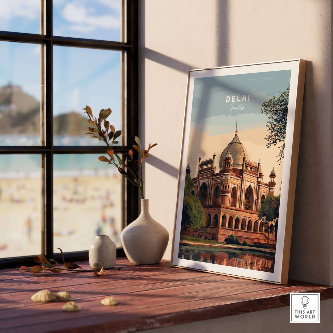 Delhi travel poster showcasing Humayun's Tomb framed on a wooden shelf with a view of the outdoors.