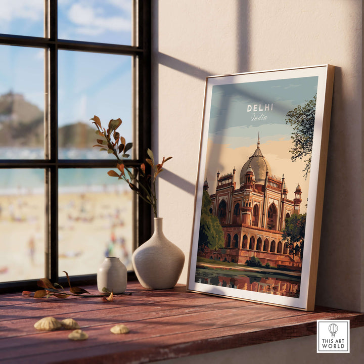 Delhi travel poster showcasing Humayun's Tomb framed on a wooden shelf with a view of the outdoors.