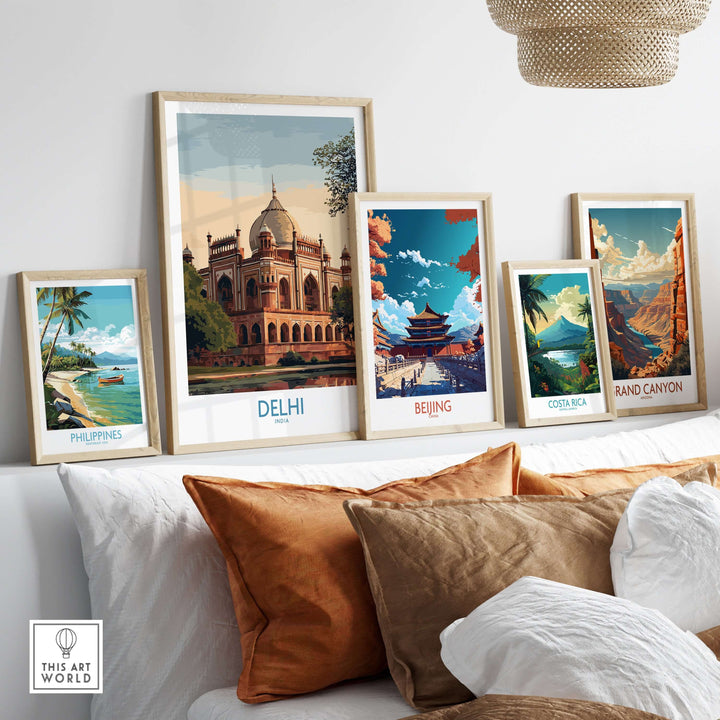 Art prints featuring landmarks from Delhi, Beijing, Philippines, Costa Rica, and the Grand Canyon displayed on a sofa.