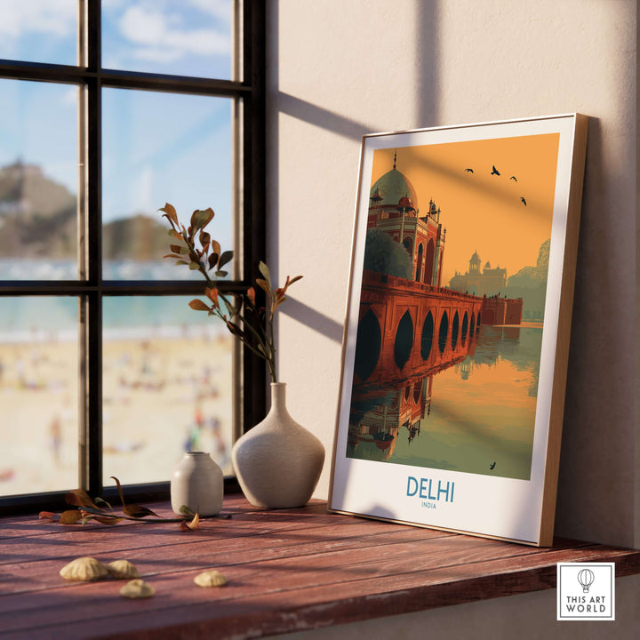 Framed travel poster of Humayun's Tomb in Delhi, showcasing a sunset view with an arched bridge and birds.